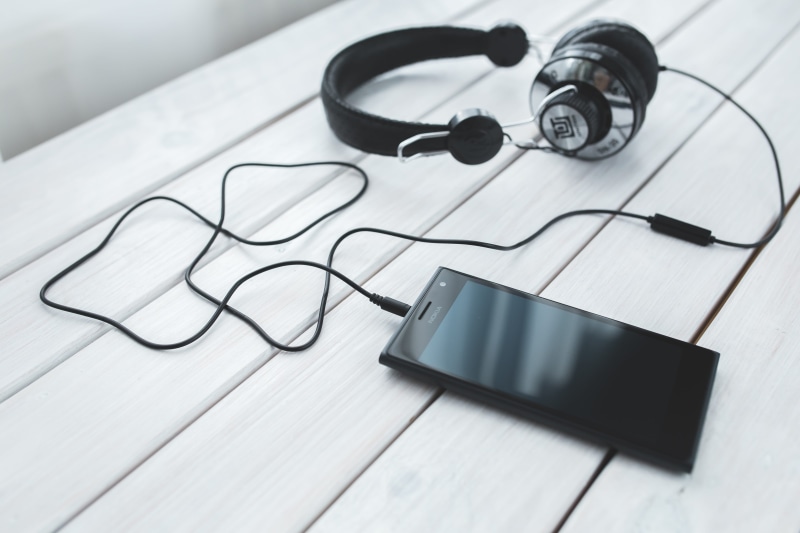 close-up, indoors, device, high angle view, black color, medical, desk, music, two objects, creativity, office, medicine, communication, electronics, paper