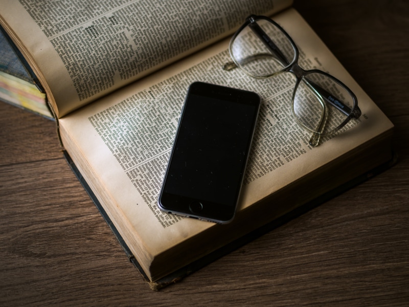 portable information device, hardbound, library, beside, communication, lay, media, telephone, technology, flat, literature, space, wireless technology