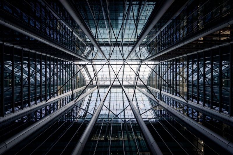 glass - material, skylight, city, glass, tall - high, 5K, sunlight, pattern, steel, modern, no people, indoors, skyscraper, structure, building, architectural feature