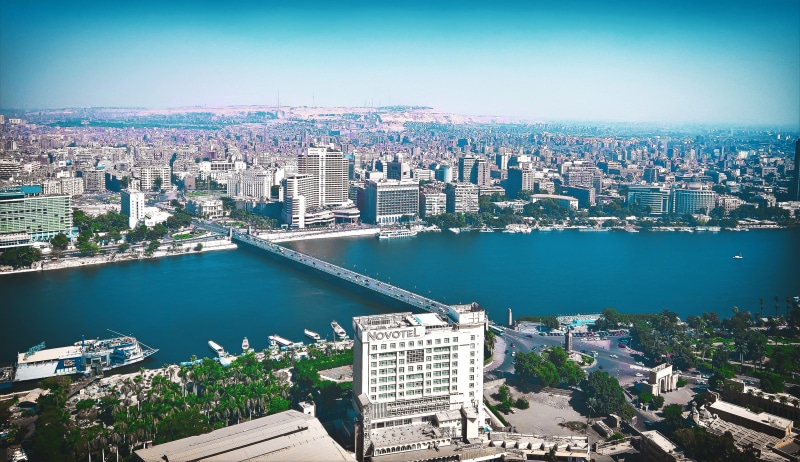 transportation, outdoors, hotel, no people, nature, ship, water, nile, residential district, high angle view, sky, trees, cairo, urban skyline, building exterior