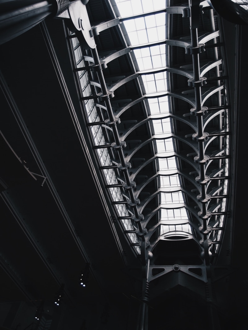 shopping mall, glass - material, design, indoors, in a row, low angle view, day, skylight, building, sunlight, 2K, ceiling, architecture, construction site