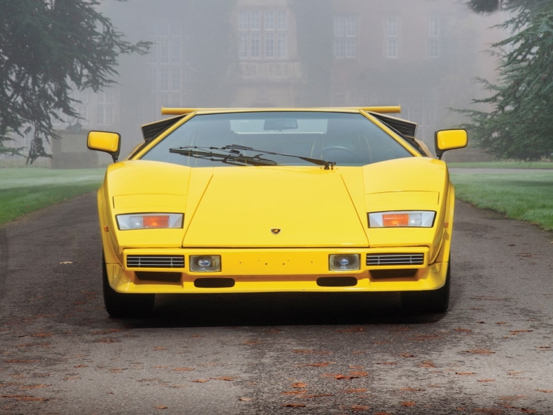 outdoors, stationary, yellow taxi, 720P, mode of transportation, classic car, road, yellow cars, motor vehicle, transportation, city, plant, land vehicle