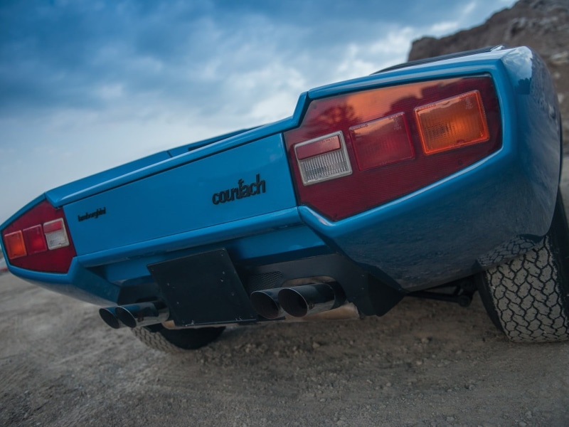outdoors, day, western script, public transportation, old, classic car, wheel, side view, transportation, blue cars, sky, cloud - sky, Lamborghini Countach