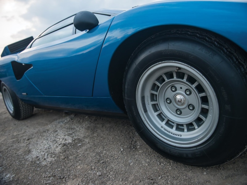 wealth, street, black color, travel, motor vehicle, stationary, road, wheel, close-up, car, day, blue, land vehicle, Lamborghini Countach, luxury, no people