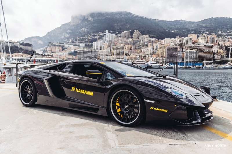 architecture, water, Monaco, motor vehicle, nautical vessel, black cars, day, cityscape, building exterior, transportation, city, land vehicle, mode of transportation