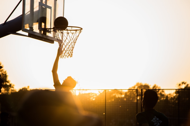 outdoors, activity, sunlight, game, sunset, team, people, shot, 5K, player, basketball hoop, child, boundary, champion, leisure, net, blue, playing, bounce