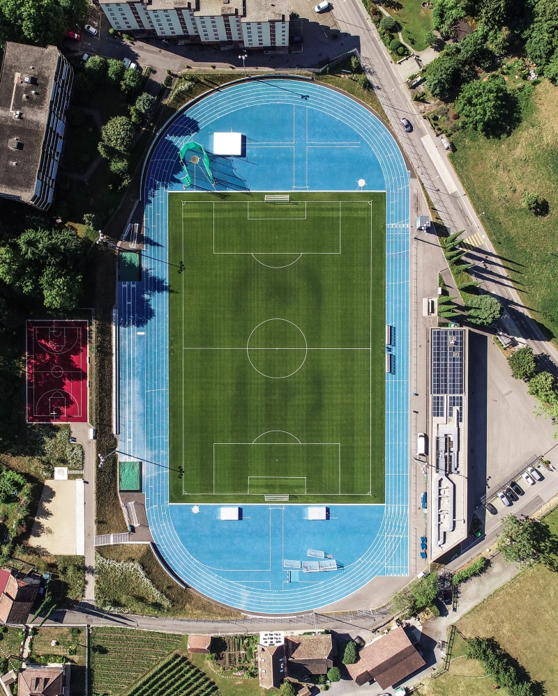 athletic, aerial, gate, drone view, office building, sport, architecture, soccer, road, switzerland, plant, daytime, court, day, tree, nature, built structure