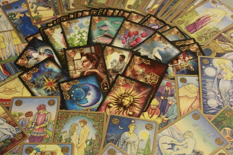 pattern, card, color, backgrounds, large group of objects, choice, divination, deck, tarot, variation, indoors, collection, tarot card, male likeness, no people
