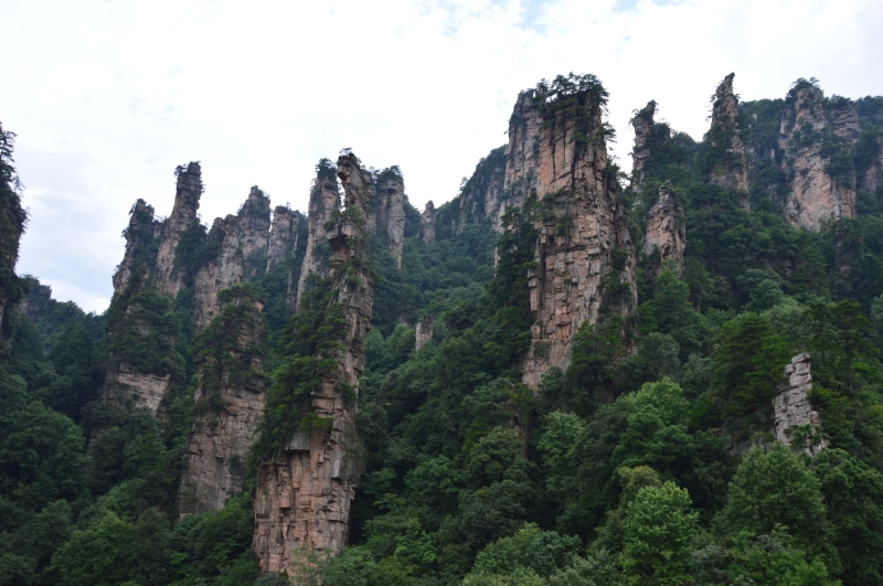 no people, outdoors, land, tree, day, scenics - nature, sky, tranquil scene, zhangjiajie, travel, beauty in nature, forest, mountain, rock, formation, hunan