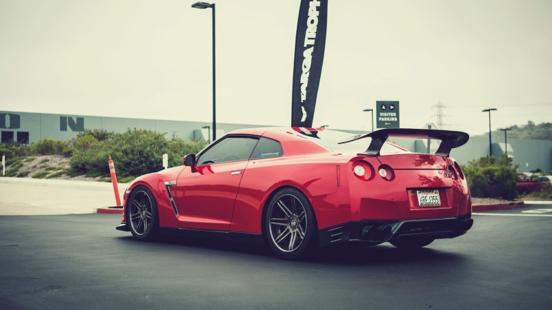 architecture, 1080P, day, motor vehicle, red, city, transportation, outdoors, sports car, land vehicle, car, coupe, sky, luxury, sports, retro styled