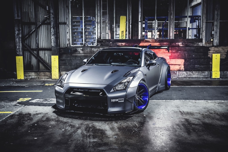 vehicle, motor vehicle, land vehicle, building exterior, parking, day, built structure, 1080P, stationary, sports car, building, Nissan, car, architecture
