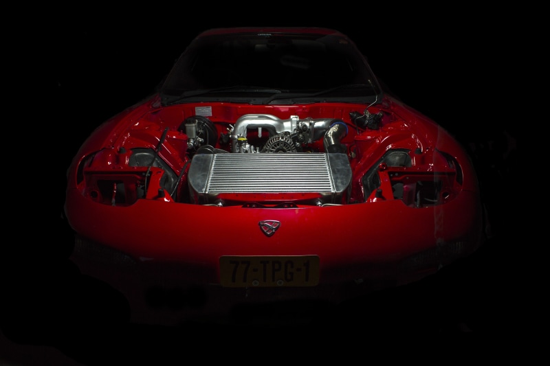 engine, front view, mazda rx7, red, cut out, security, close-up, land vehicle, motor vehicle, no people, car, technology, indoors, retro styled, mode of transportation