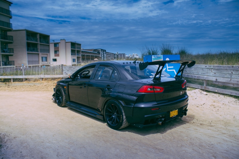 built structure, sedan, day, drift, road, Mitsubishi, black, stationary, car, cloud - sky, land vehicle, motor vehicle, travel, building, Mitsubishi Lancer