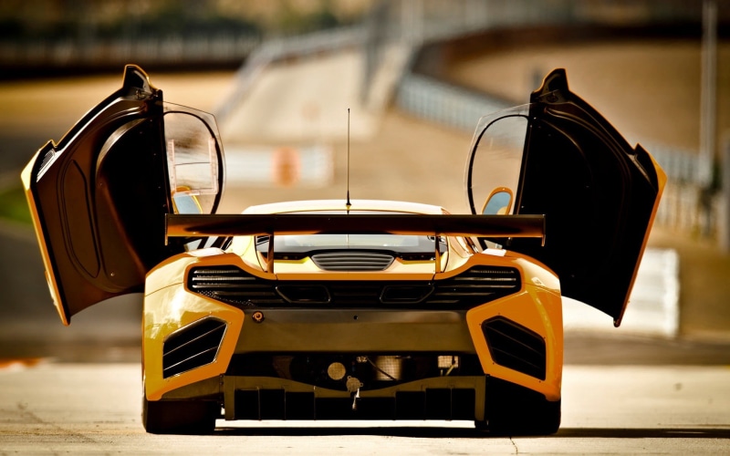 focus on foreground, 1080P, still life, absence, sports, scooter, retro styled, no people, table, McLaren MP4-12C, close-up, nostalgia, McLaren, motor vehicle