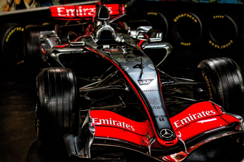 retro styled, vehicle part, champion, vehicle, day, black, wheel, competition, mclaren, mode of transportation, formula, indoors, western script, racing