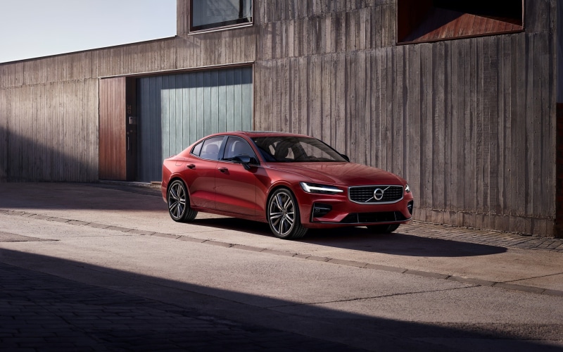 red, building exterior, city, outdoors, Volvo, wall, building, car, architecture, luxury, sunlight, mode of transportation, old, day, built structure, street
