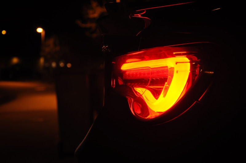 black background, orange color, close-up, helmet, 4K, laser, neon, led, motor vehicle, headlight, nature, traffic, no people, night, sweden, clothing