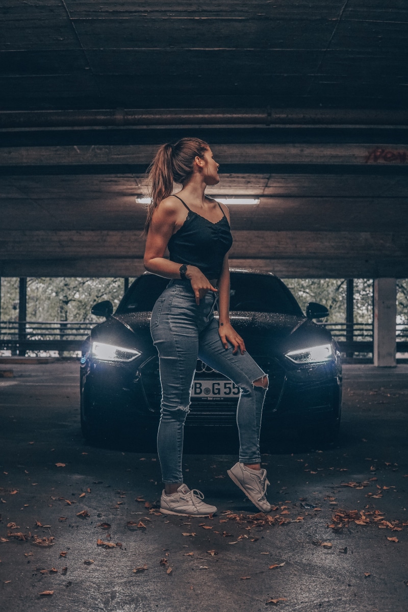jeans, hairstyle, clothing, indoors, parking, wheel, car wheel, asphalt, parked, women, young women, casual clothing, abandoned, machine, lifestyles, beauty