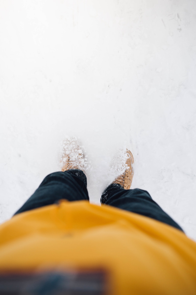 white, bobsled, human body part, motion, sport, apparel, sneaker, one person, shoe, personal perspective, running shoe, cold temperature, wheel, lifestyles