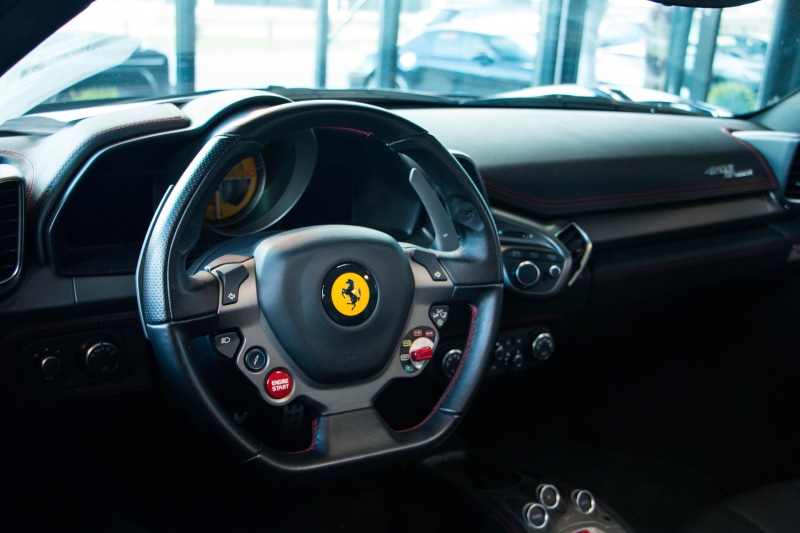 indoors, steering wheel, speedometer, wheel, mode of transportation, focus on foreground, car interior, wealth, windshield, luxury, Ferrari, Ferrari 458 Speciale