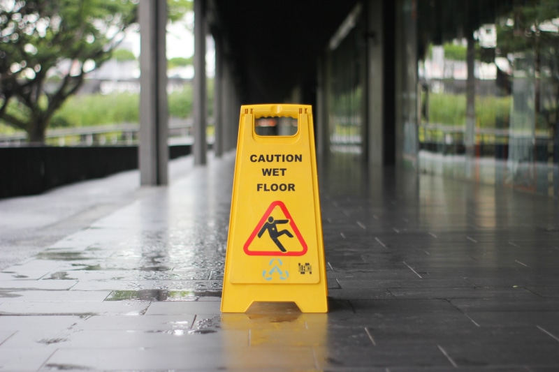 safety, tiled floor, signage, warning symbol, information sign, wet, caution, text, sign, information, no people, yellow, protection, outdoors, slippery