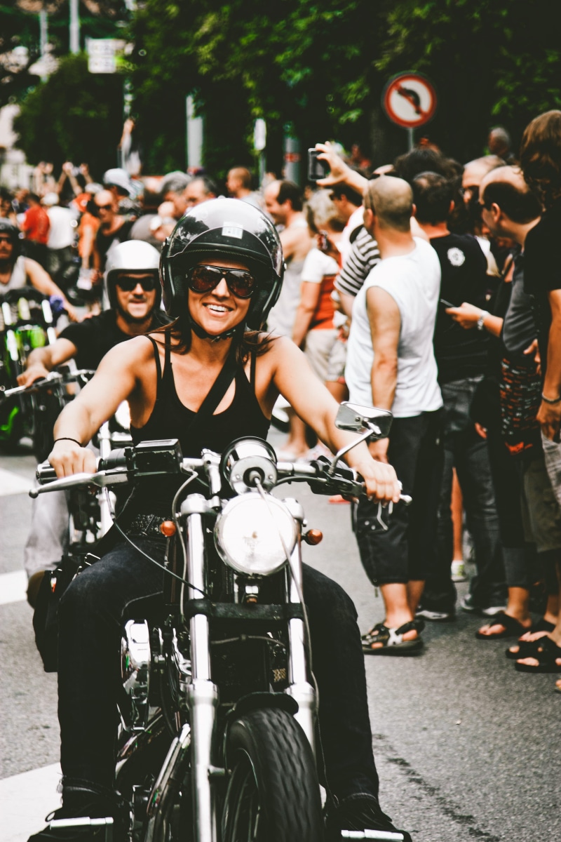 focus, biking, wear, audience, bicycle, wheel, smiling, road, lifestyles, parade, helmet, outdoors, transportation, street, crowd, female, ride, chopper