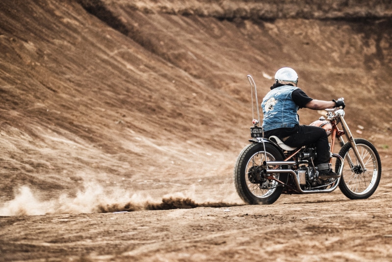 crash helmet, outdoors, rural Scene, rear view, extreme Sports, off-Road Vehicle, dirt, daytime, speed, adults only, action, motorcycle, sports Race, ride