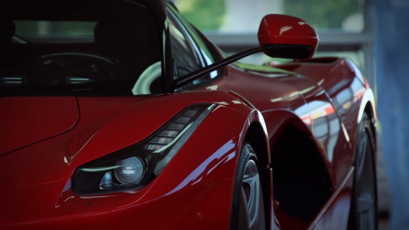 modern, outdoors, land vehicle, Ferrari, city, shiny, no people, traffic, motor vehicle, 1080P, close-up, reflection, mode of transportation, car, motion