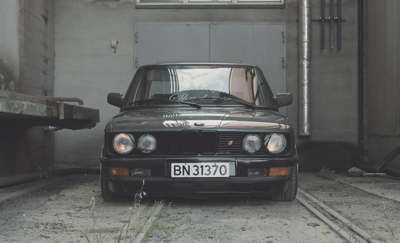 Norway, no people, western script, motor vehicle, mode of transportation, text, land vehicle, front view, 4K, city, BMW, communication, day, vintage car