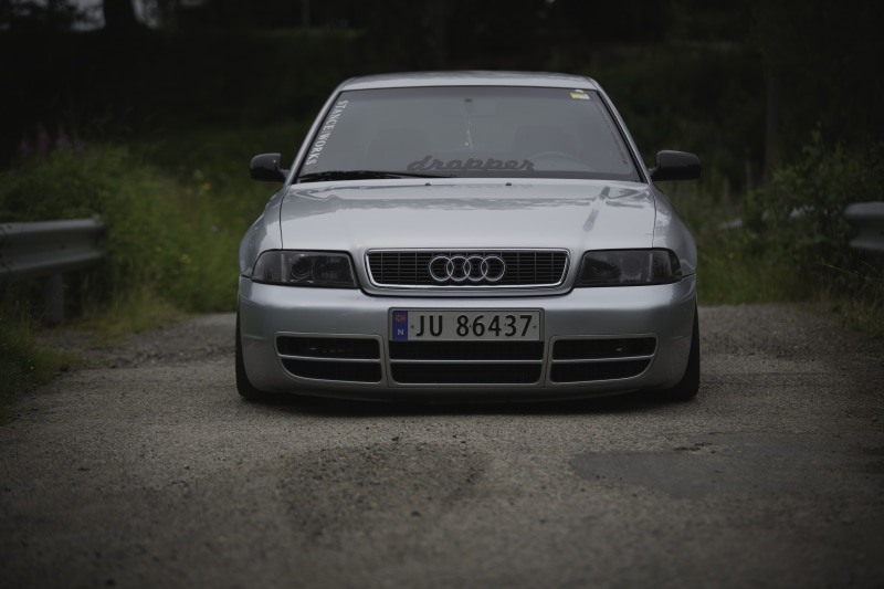 text, front view, audi, nature, land vehicle, road trip, outdoors, motor vehicle, no people, city, street, day, Stanceworks, road, plant, car, Norway, toy