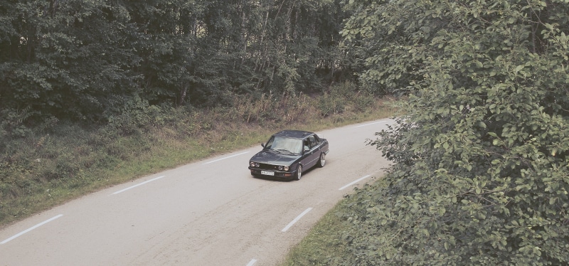BMW E28, tree, black, outdoors, 4K, nature, transportation, motion, land, no people, direction, door, hatchback, car, BMW, travel, low, Norway, plant