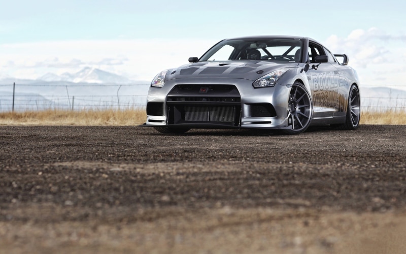 field, white, nature, outdoors, tire, no people, mode of transportation, sports car, black, land vehicle, selective focus, motor vehicle, chevrolet, wheel