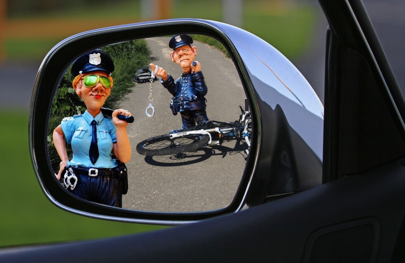 day, offspring, headwear, riding, police officers, motor vehicle, people, woman, boys, man, outdoors, emotion, hit and run, bicycle, family, police, sport