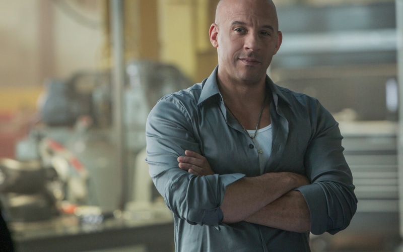 front view, dominic toretto, small Business, one Man Only, mature Adult, focus on foreground, sitting, vin, businessman, owner, casual Clothing, confidence