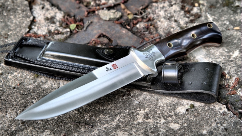 knife - weapon, black, directly above, metal, steel, hand tool, single object, work tool, knife, sheath, still life, day, wrench, solid, equipment, survival