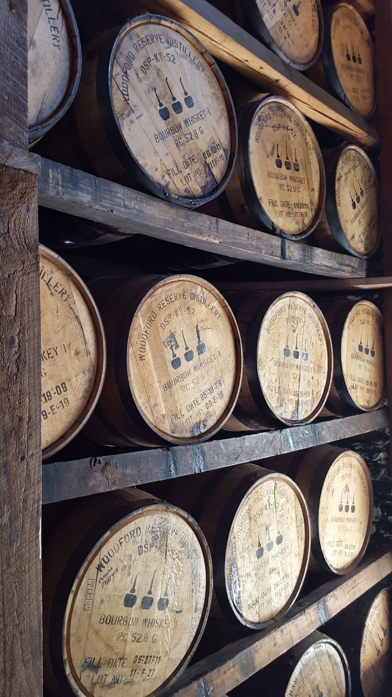 no people, woodford reserve, wine, shelf, circle, order, cylinder, arrangement, shape, side by side, barrel, bourbon, container, stack, in a row, still life