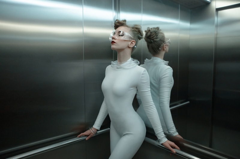 retail, representation, indoors, clothing, elevator, adult, women, human representation, looking, 1080P, jumpsuit, technology, beauty, people, s, fashion