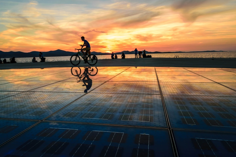 travel, sky, cycling, built structure, sunset, sea organ, croatia, adriatic sea, cycle, shore, beauty in nature, nature, activity, reflection, orange color