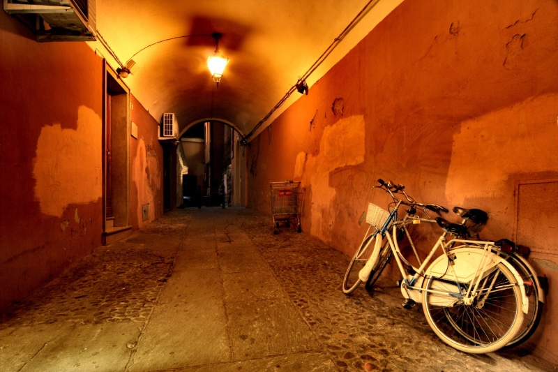 no people, built structure, city, gear, time, 2K, travel, nighttime, bologna, two bicycles, wall, vehicle, parked, two, stationary, architecture, old