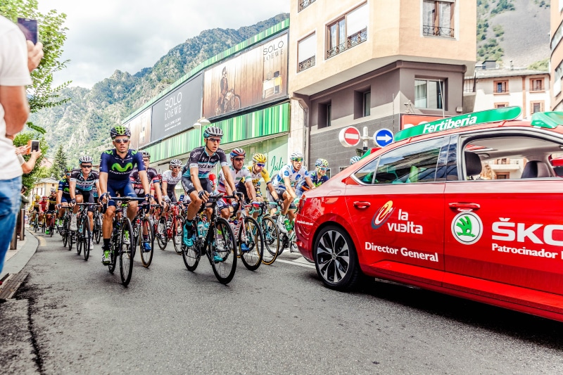 riding, race, tournament, car, mountains, 5K, Tour de France, city, built structure, outdoors, red, men, motor vehicle, route, hill, land vehicle, architecture