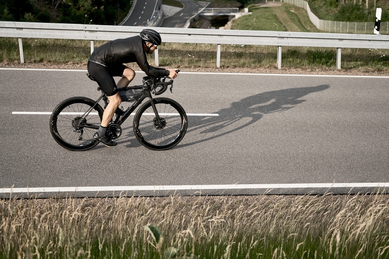 champion, competition, travel, road bike, downhill, endurance, transportation, land vehicle, one person, bike, shadow, day, road, race, race bike, activity
