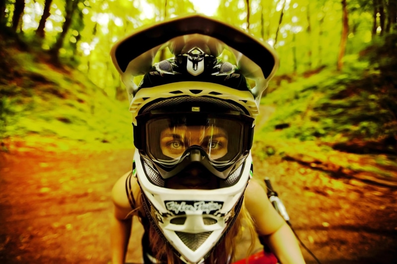 land, plant, helmet, day, white, outdoors, one person, looking at camera, forest, tree, motorcycle, women outdoors, leisure activity, nature, portrait