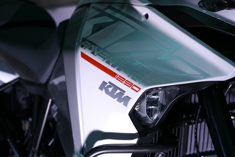 sign, black, 2K, gray, security, land vehicle, day, vehicle, text, car, KTM, focus on foreground, motorcycle, selective focus, technology, communication