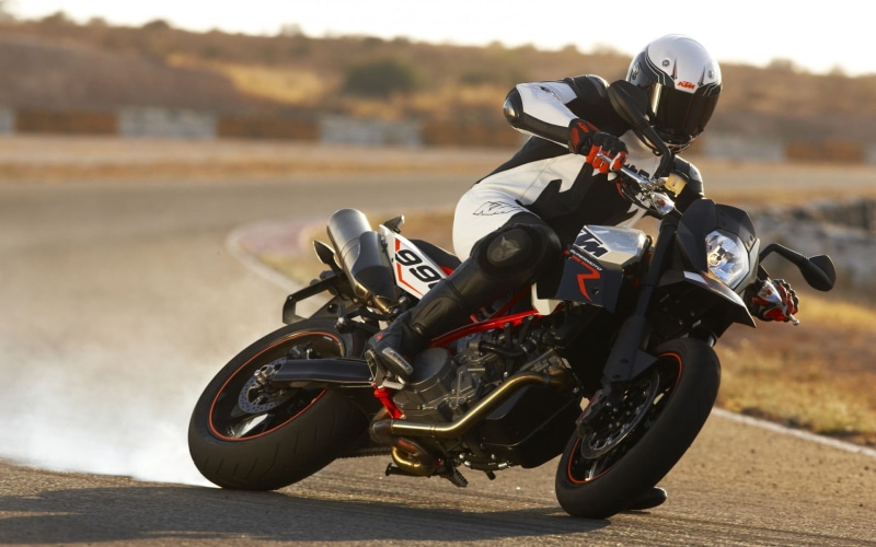 headwear, motorcycle, crash helmet, ride, supermoto, duke, sport, one person, transportation, mode of transportation, day, driving, outdoors, helmet, sports helmet