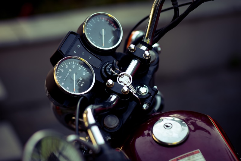 mode of transportation, focus, maroon, selective, machinery, equipment, air vehicle, rev counter, focus on foreground, speedometer, motorcycle, close-up