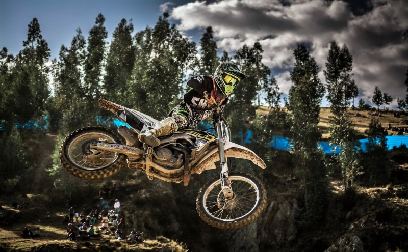 crash helmet, transportation, outdoors, skill, mode of transportation, extreme sports, stunt, bicycle, motocross, sport, low angle view, helmet, day, nature