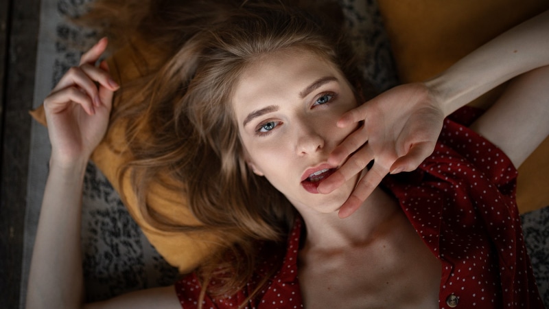 human arm, hand, women, indoors, mouth open, arms raised, shock, looking at camera, finger on lips, emotion, beautiful woman, body part, hair, teenager