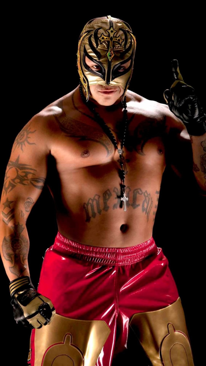tattoo, semi-dress, one person, rey mysterio, portrait, WWE, rey, young adult, studio shot, body part, waist up, black background, costume, red, adult