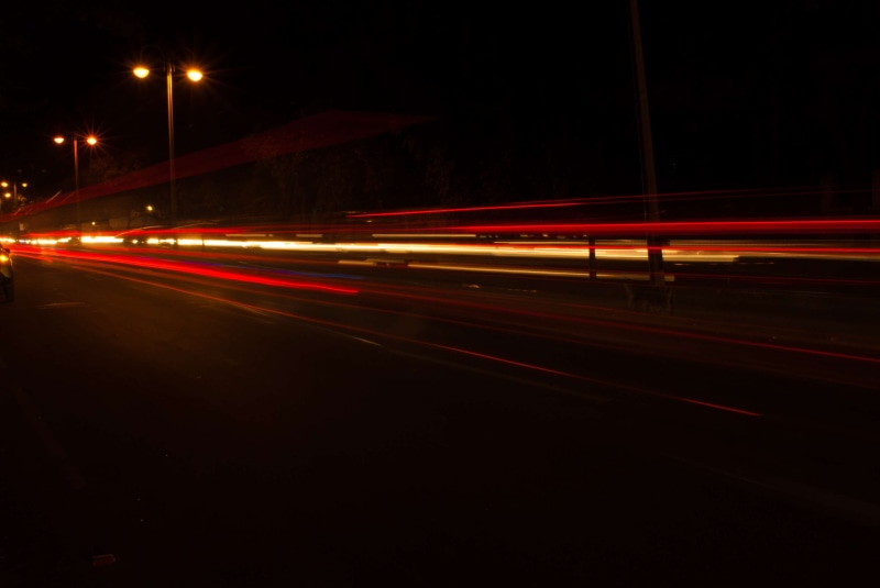 speed, outdoors, tail light, 4K, city street, illuminated, long exposure, night, light trail, motion, nightlife, light streaks, multiple lane highway