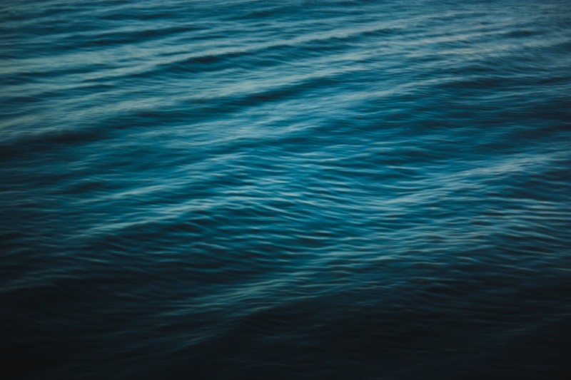 waterfront, blue, minimal, cold, western cape, blurry, soft, vignette, tranquil scene, photo, muted, flowing water, no people, slow shutter, rippled, 4K